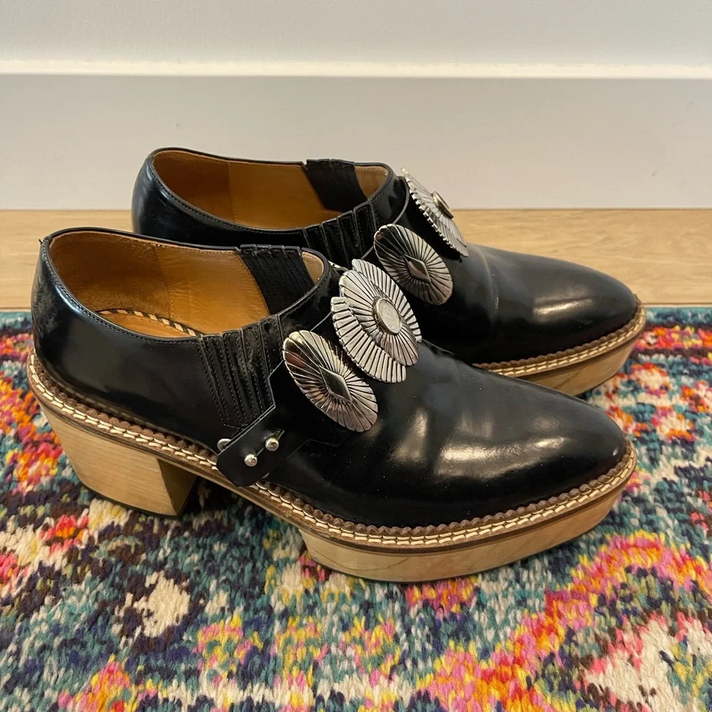 TOGA Pulla Black Leather Platform Slip-On Shoes with Silver Conchos